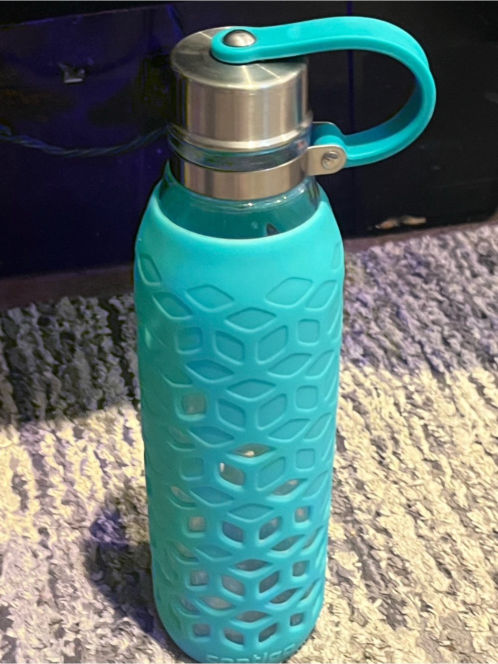 Contigo brand Glass Water Bottle with Teal Silicone Sleeve and Stainless Cap